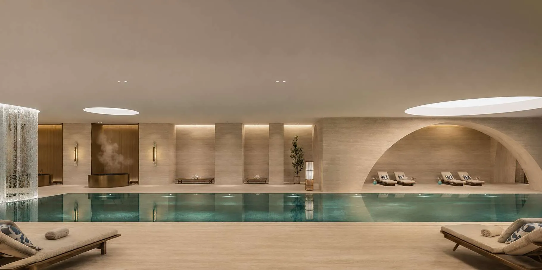 Indoor lap pool with loungers at AHS Twin Towers