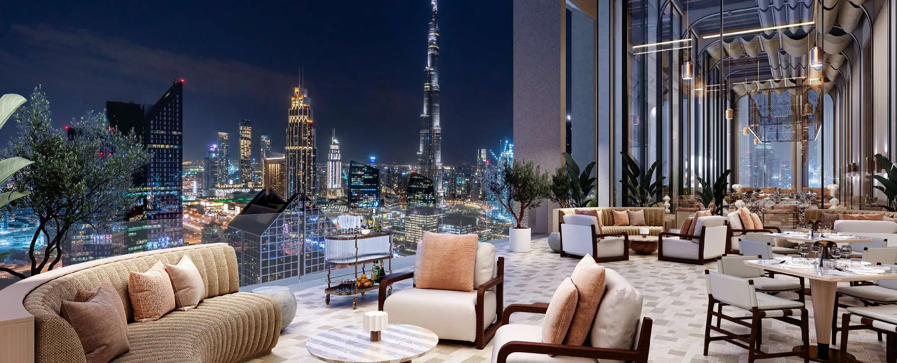 Rooftop lounge facing Burj Khalifa at night at AHS Twin Towers