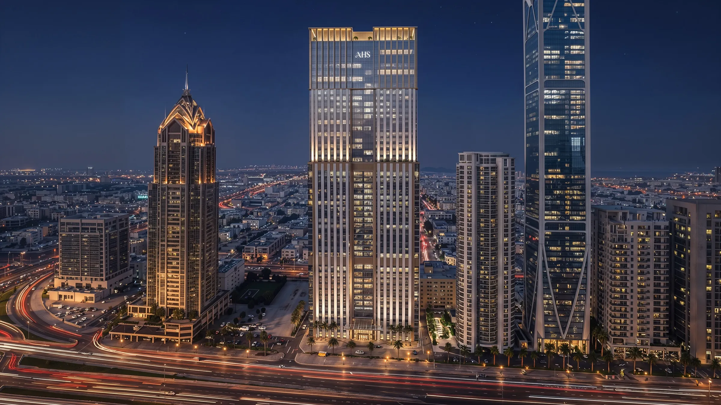 AHS Twin Towers illuminated at night on Sheikh Zayed Road
